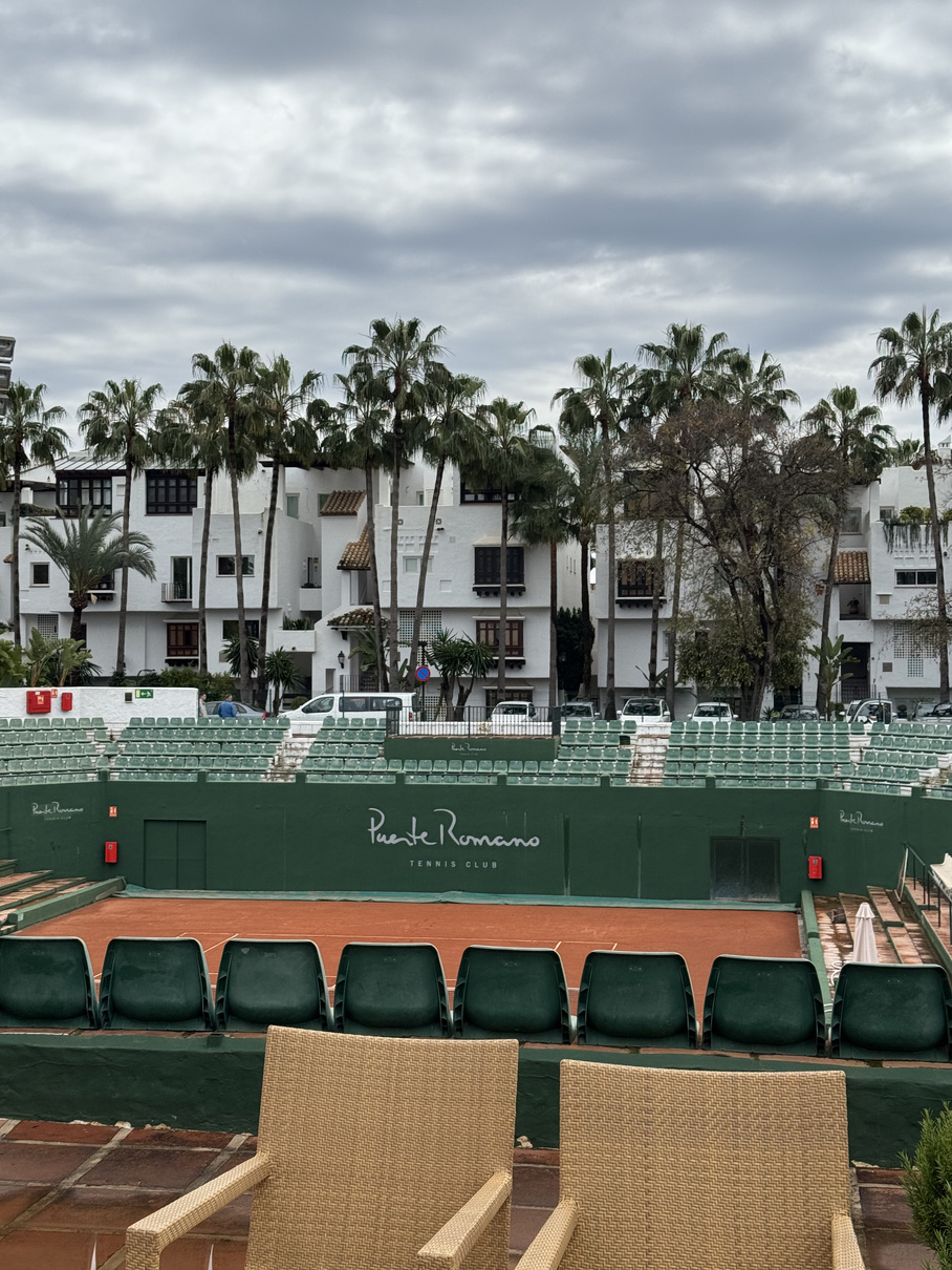 Puente Romano tennis club — clay court and stadium stands, Marbella