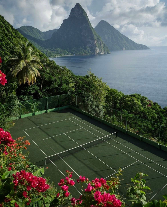 Tropical tennis court with volcanic peaks, St Lucia